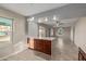 Renovated kitchen with island, new cabinetry, and quartz countertops at 6443 E Alder Ave, Mesa, AZ 85206