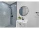 Bathroom with gray tile shower and white vanity at 6613 W Sweetwater Ave, Glendale, AZ 85304