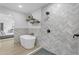 Spa-like bathroom with freestanding tub and herringbone shower tile at 6613 W Sweetwater Ave, Glendale, AZ 85304