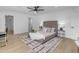 Bright bedroom with a king-size bed and en-suite bathroom at 6613 W Sweetwater Ave, Glendale, AZ 85304