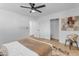 Bedroom with ceiling fan, closet, and modern art at 6613 W Sweetwater Ave, Glendale, AZ 85304