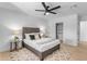 Guest bedroom with gray bed frame, ceiling fan and closet at 6613 W Sweetwater Ave, Glendale, AZ 85304