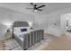 Bedroom with gray bed frame, ceiling fan and closet at 6613 W Sweetwater Ave, Glendale, AZ 85304