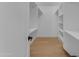 Spacious walk-in closet with built-in shelves and ample storage at 6613 W Sweetwater Ave, Glendale, AZ 85304