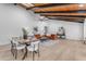 Open concept dining room and living room with modern decor and vaulted ceilings at 6613 W Sweetwater Ave, Glendale, AZ 85304