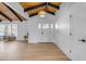 Bright and airy entryway with hardwood floors and a view of the living room at 6613 W Sweetwater Ave, Glendale, AZ 85304
