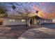 Stunning curb appeal with a large driveway and desert landscaping at 6613 W Sweetwater Ave, Glendale, AZ 85304