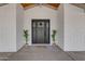 Dark gray front door with glass panels and welcoming 'Welcome friends & Gathering' mat at 6613 W Sweetwater Ave, Glendale, AZ 85304