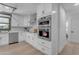 Modern kitchen with white cabinets, double oven, and stainless steel appliances at 6613 W Sweetwater Ave, Glendale, AZ 85304