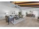 Living area with high ceilings, hardwood floors, and stylish seating arrangement at 6613 W Sweetwater Ave, Glendale, AZ 85304