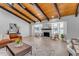 Bright living room with vaulted ceilings, a fireplace and a view of the backyard at 6613 W Sweetwater Ave, Glendale, AZ 85304