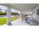 Covered patio with dining table and chairs, offering a relaxing outdoor space at 6613 W Sweetwater Ave, Glendale, AZ 85304