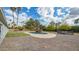 Inviting pool area with waterfall feature, artificial turf, and gravel at 6613 W Sweetwater Ave, Glendale, AZ 85304