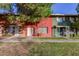 Two-story building with red and green painted brick exterior and grassy lawn at 6654 N 43Rd Ave, Glendale, AZ 85301