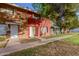 Red and green brick duplex with a walkway and lawn at 6654 N 43Rd Ave, Glendale, AZ 85301