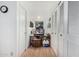 Bright hallway with wood floors, ample closet space, and decorative accents at 6654 N 43Rd Ave, Glendale, AZ 85301