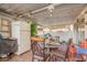Covered patio with seating area, a table, and a refrigerator at 6654 N 43Rd Ave, Glendale, AZ 85301