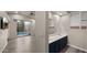 Modern bathroom with double vanity and view of pool at 6703 W Linda Ln, Chandler, AZ 85226