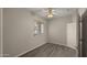 Simple bedroom with wood-look floors and ceiling fan at 6703 W Linda Ln, Chandler, AZ 85226