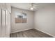 Well-lit bedroom with wood-look floors at 6703 W Linda Ln, Chandler, AZ 85226