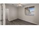 Bright bedroom featuring wood-look floors at 6703 W Linda Ln, Chandler, AZ 85226