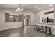 Open kitchen and dining area with modern appliances at 6703 W Linda Ln, Chandler, AZ 85226