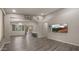 Spacious living room with gray walls and wood-look floors at 6703 W Linda Ln, Chandler, AZ 85226