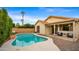 Inviting kidney-shaped pool with surrounding patio at 6703 W Linda Ln, Chandler, AZ 85226