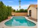 Inviting kidney-shaped pool with surrounding landscaping at 6703 W Linda Ln, Chandler, AZ 85226