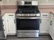 Close-up view of the stainless steel gas range with cooktop and oven in the kitchen at 6703 W Linda Ln, Chandler, AZ 85226