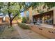 Landscaped backyard pathway leading to a patio and building at 7438 E Hum Rd # 101, Carefree, AZ 85377
