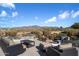Relaxing backyard patio with fire pit and mountain views at 7438 E Hum Rd # 101, Carefree, AZ 85377