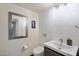 Clean bathroom with white subway tile, floating vanity, and modern fixtures at 7438 E Hum Rd # 101, Carefree, AZ 85377