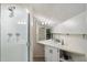 Well-lit bathroom with a shower, corner vanity, and updated fixtures at 7438 E Hum Rd # 101, Carefree, AZ 85377