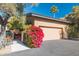 Attached garage with vibrant bougainvillea at 7438 E Hum Rd # 101, Carefree, AZ 85377