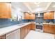 Modern kitchen with blue tile backsplash and stainless steel appliances at 7438 E Hum Rd # 101, Carefree, AZ 85377