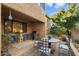 Inviting patio with seating area, grill, and lush landscaping at 7438 E Hum Rd # 101, Carefree, AZ 85377