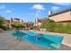 Community swimming pool with surrounding landscaping at 7438 E Hum Rd # 101, Carefree, AZ 85377