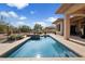 View of backyard pool, desert landscaping, patio area, and desert view fence at 7487 E Visao Dr, Scottsdale, AZ 85266