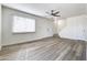 Spacious living room featuring laminate wood flooring and a view of the staircase at 948 S Alma School Rd # 160, Mesa, AZ 85210