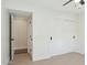 Bedroom with door to hallway and sliding closet doors at 9626 N 17Th Pl, Phoenix, AZ 85020