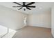 Bright bedroom with carpet, ceiling fan and sliding door to backyard at 9626 N 17Th Pl, Phoenix, AZ 85020