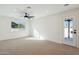 Bright bedroom with carpeted floor and access to backyard at 9626 N 17Th Pl, Phoenix, AZ 85020
