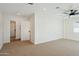 Spacious bedroom with carpet, ceiling fan and access to hallway at 9626 N 17Th Pl, Phoenix, AZ 85020