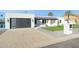 Contemporary home exterior with a large driveway at 9626 N 17Th Pl, Phoenix, AZ 85020