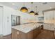 Modern kitchen with marble island and stainless steel appliances at 9626 N 17Th Pl, Phoenix, AZ 85020