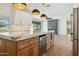 Modern kitchen with island, marble countertops, and stainless steel appliances at 9626 N 17Th Pl, Phoenix, AZ 85020
