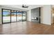 Living room with fireplace, hardwood floors and sliding doors to backyard at 9626 N 17Th Pl, Phoenix, AZ 85020