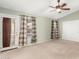 Bright bedroom with double doors and backyard access at 9930 W Burnett Rd, Peoria, AZ 85382