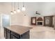 Kitchen island with granite countertop and pendant lighting at 9930 W Burnett Rd, Peoria, AZ 85382